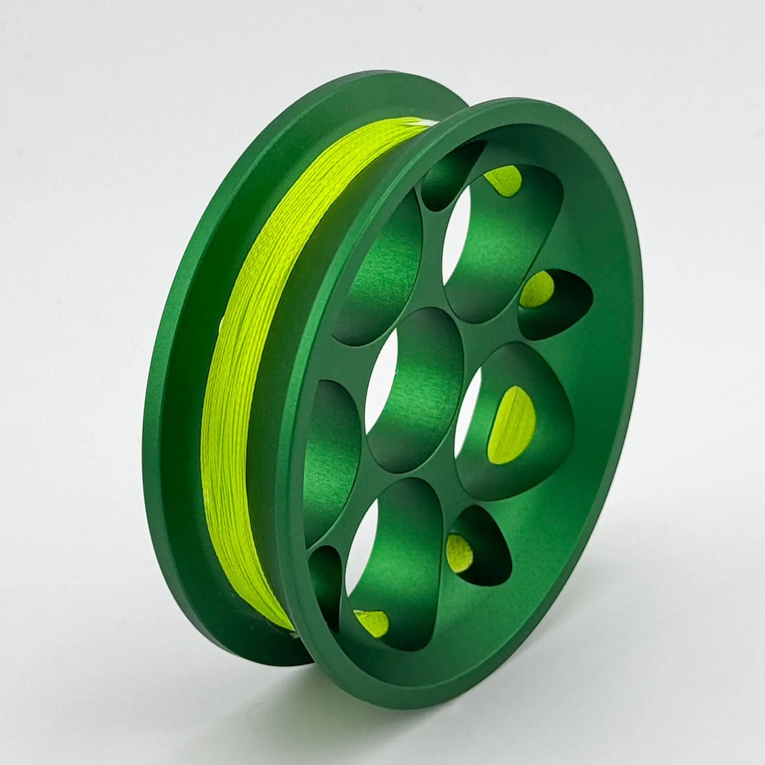 Green GoReel Pro with yellow bread on a white background